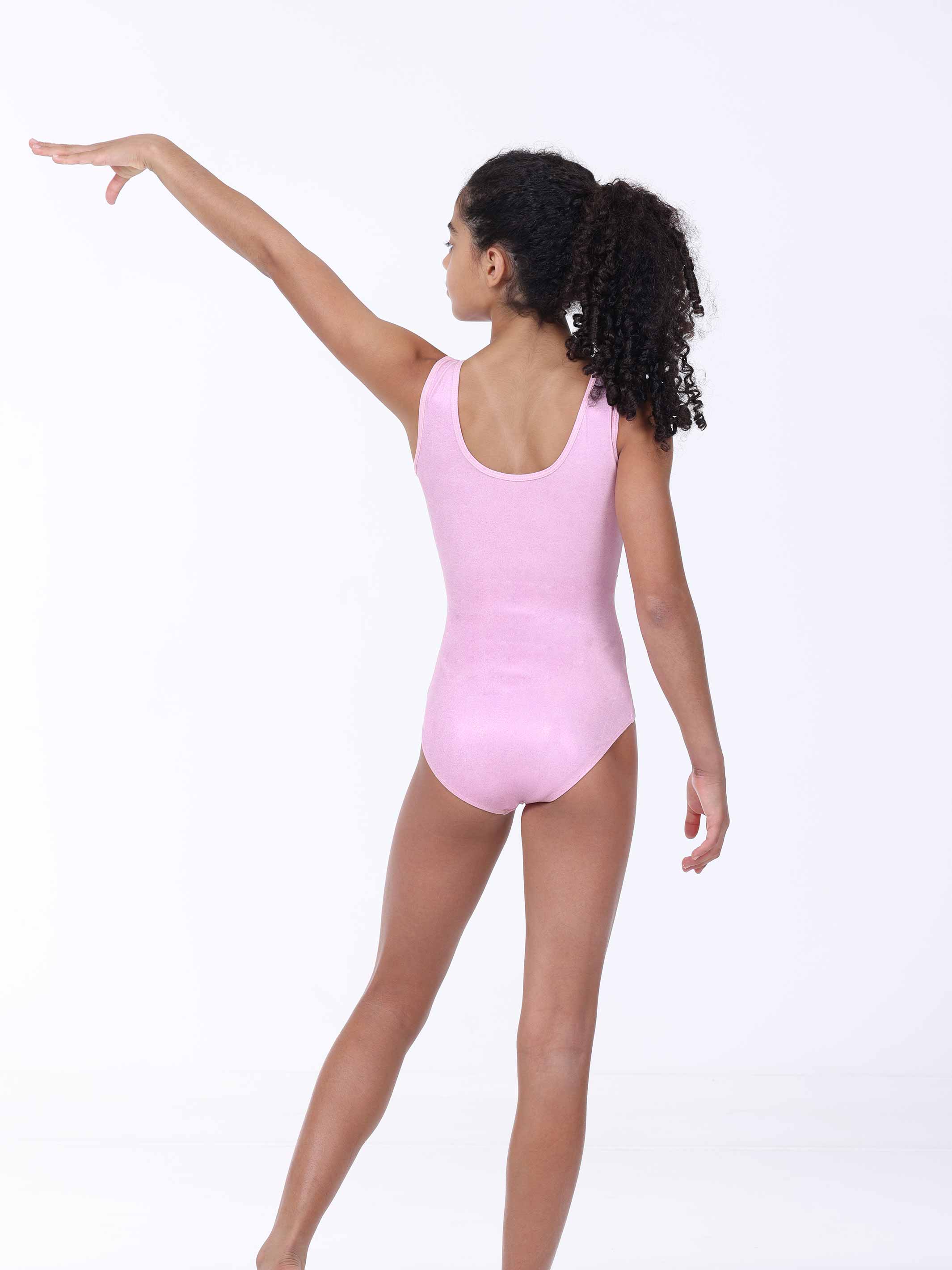 Person wearing a pink gymnastics leotard on a white background