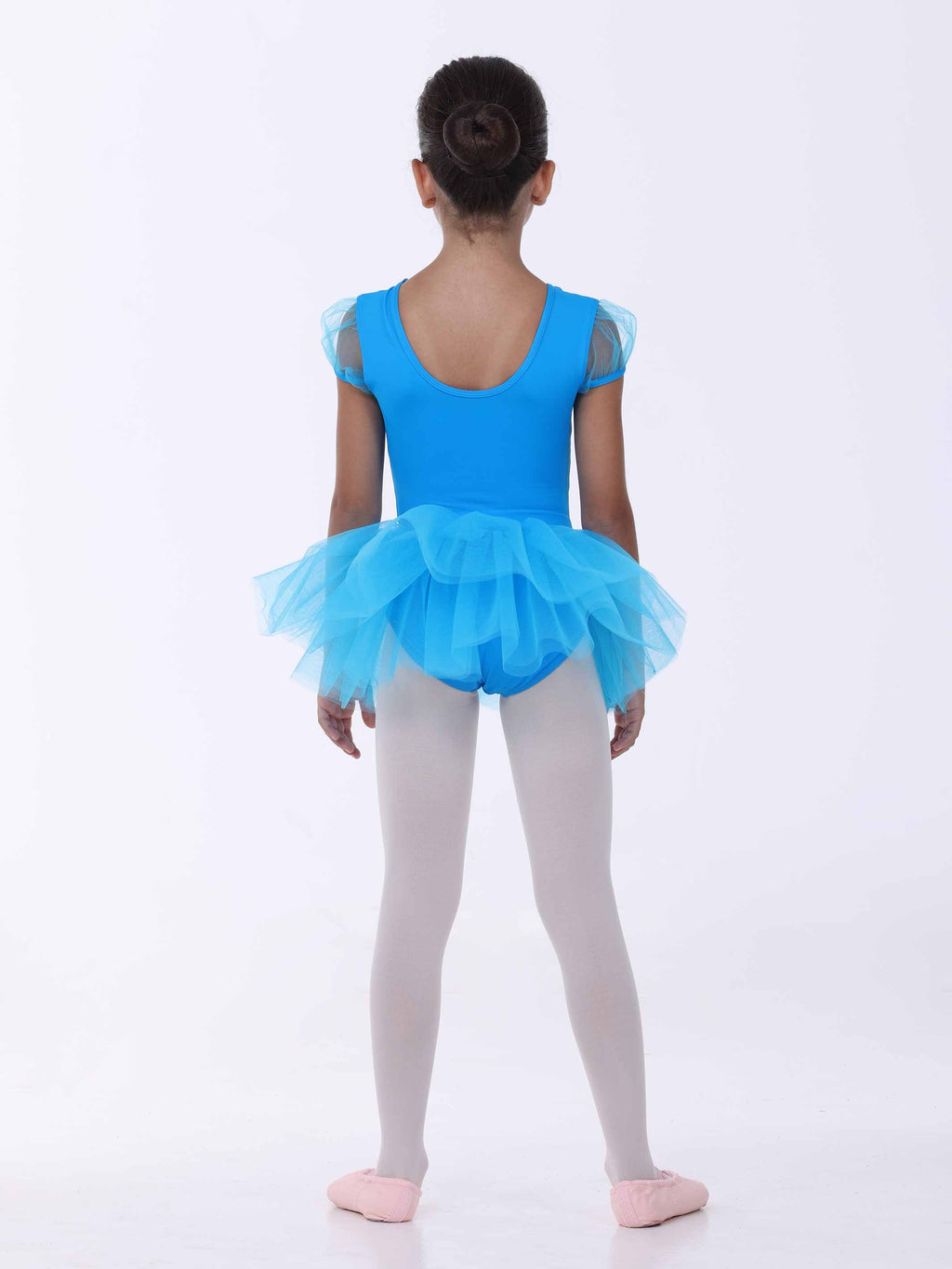Child wearing a blue tutu dress on a white background