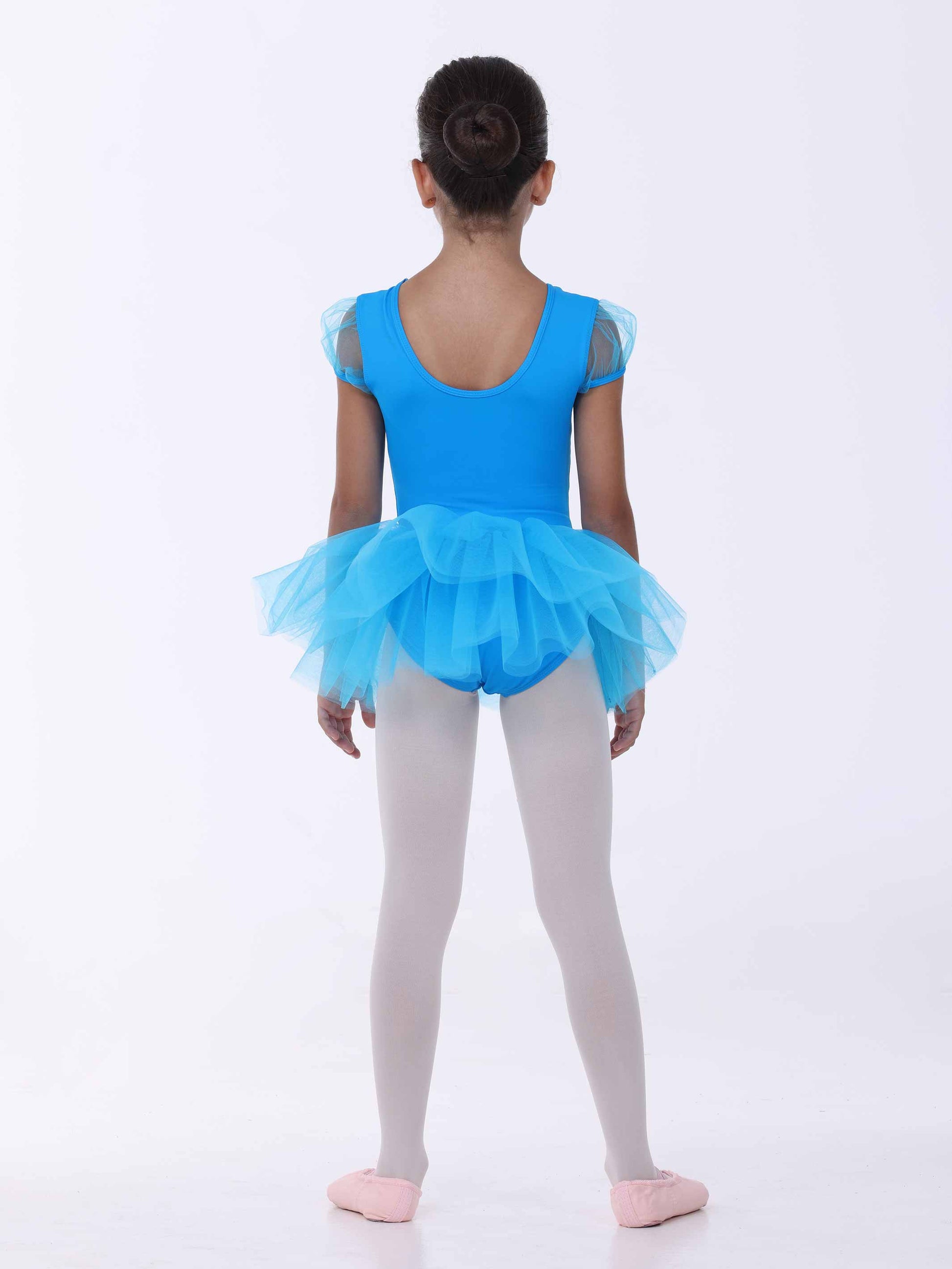 Child wearing a blue tutu dress on a white background
