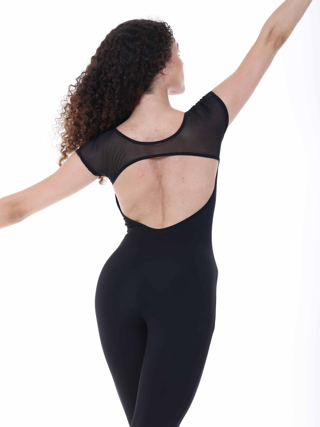 Black bodysuit worn by a model on a white background