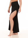 Black jazz pants with a high slit worn by a dancer on a white background