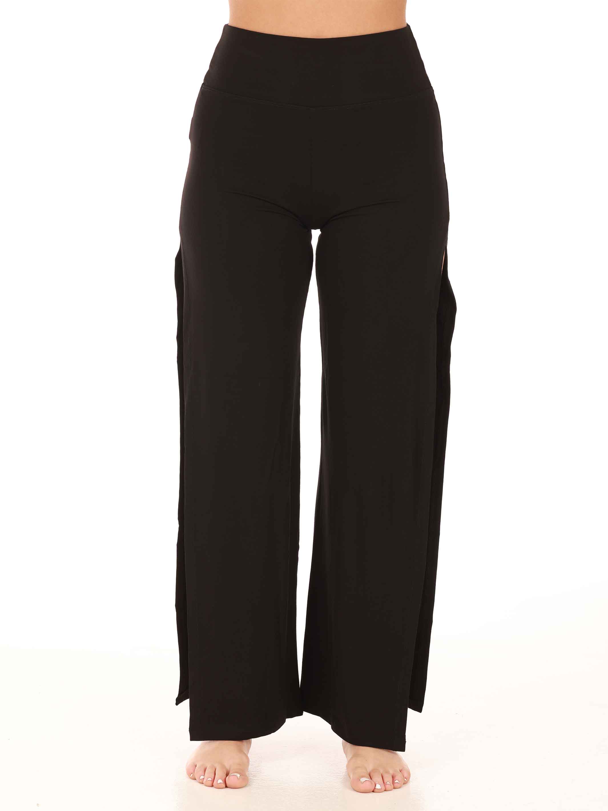Black wide-leg jazz pants worn by a person on a white background