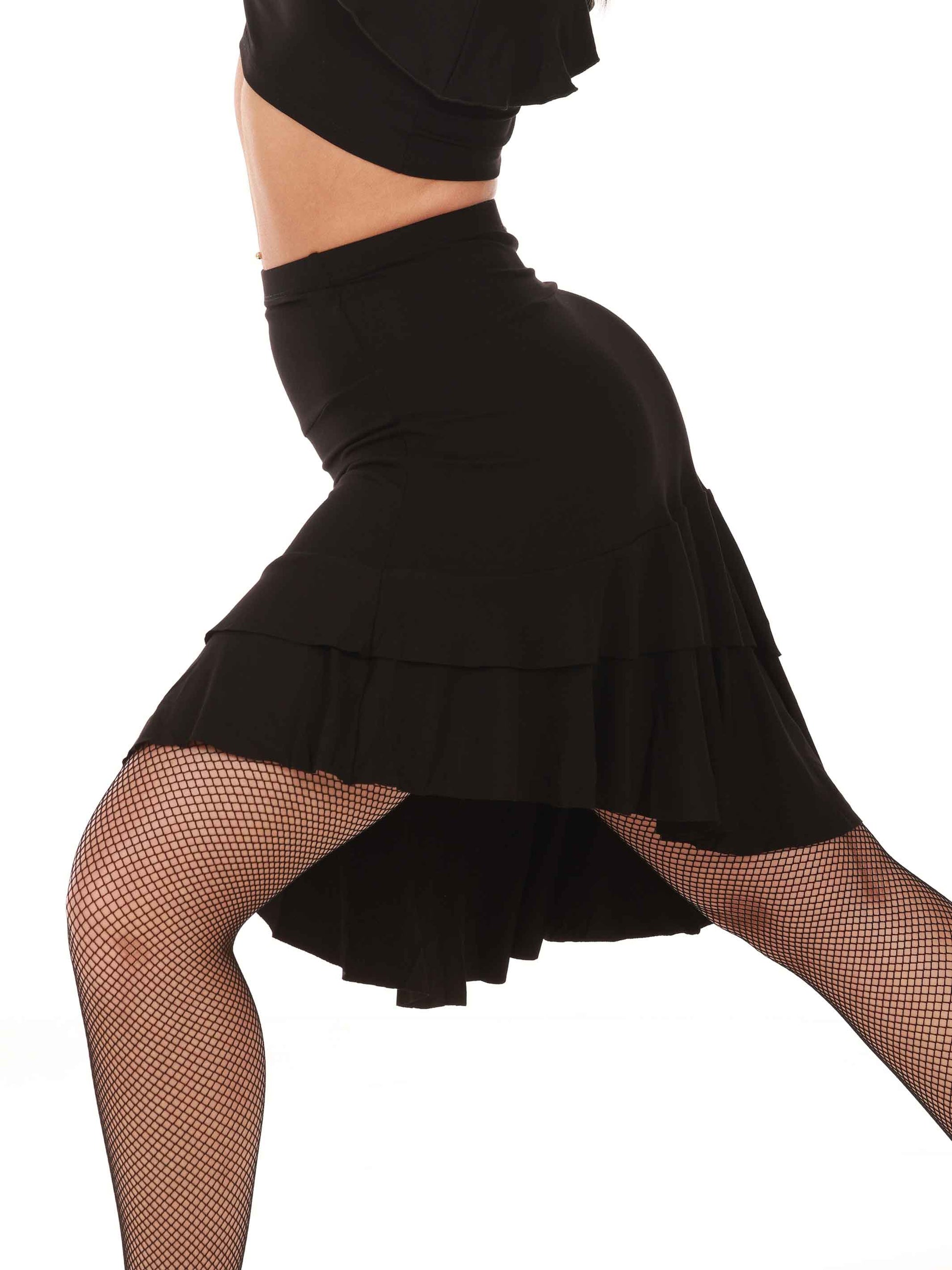 Black latin dance skirt worn by a person on a white background