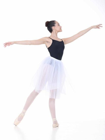Ballerina in a black leotard and white skirt on a white background