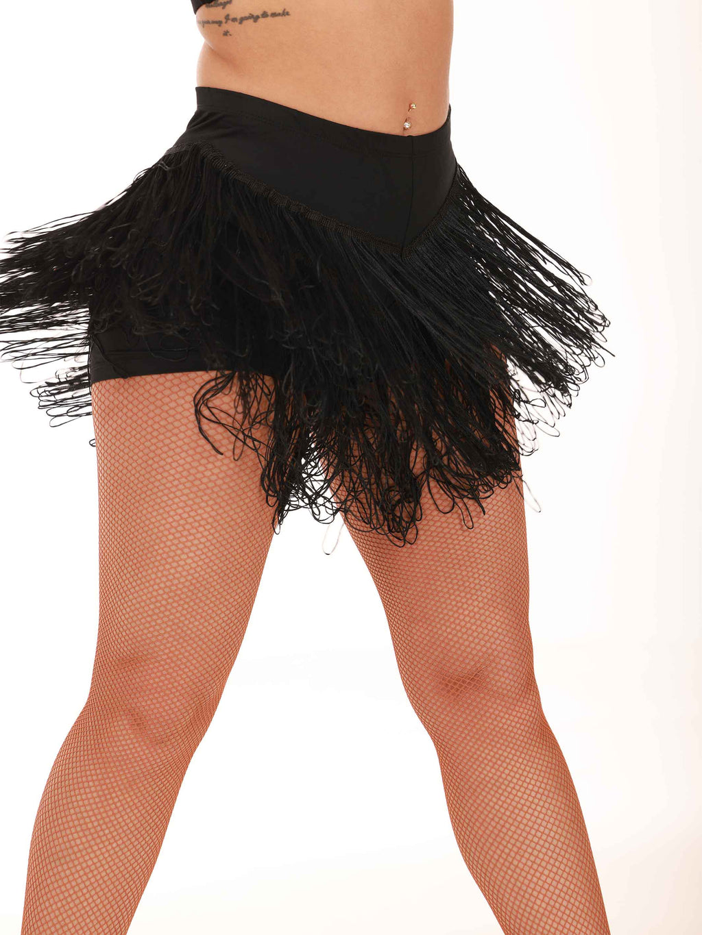 Black fringe skirt worn by a person on a white background