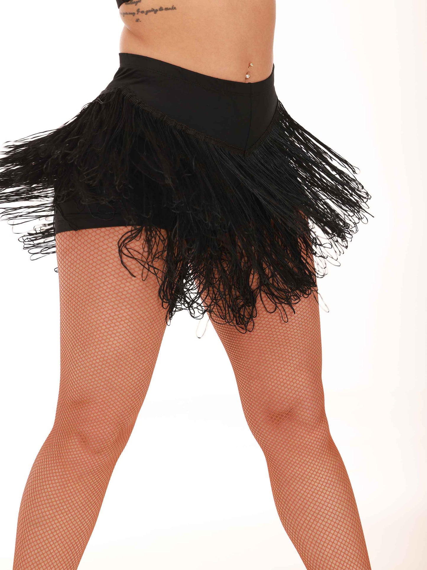 Black fringe skirt worn by a person on a white background