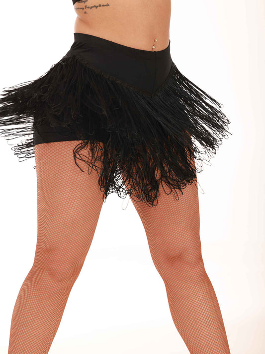 Black fringe skirt worn by a person on a white background