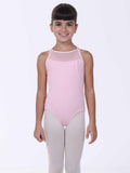Young girl wearing a light pink ballet leotard with mesh panels on a white background
