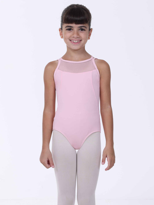 Young girl wearing a light pink ballet leotard with mesh panels on a white background
