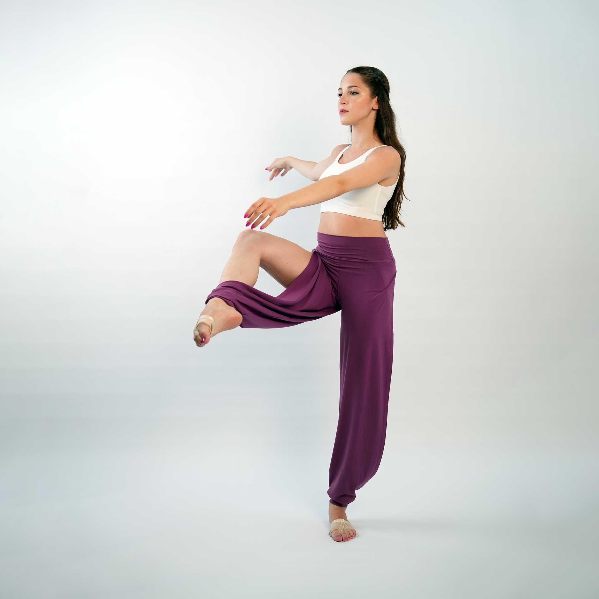 A pair of purple yoga dance jazz pants with a high-waisted fit and wide-leg design, featuring a secure waistband and a gathered ankle hem.