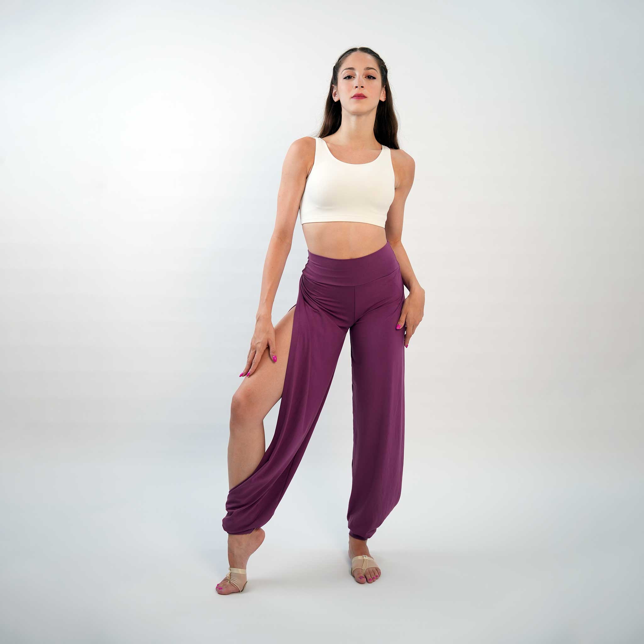 A pair of purple yoga dance jazz pants with a high-waisted fit and wide-leg design, featuring a secure waistband and a gathered ankle hem.