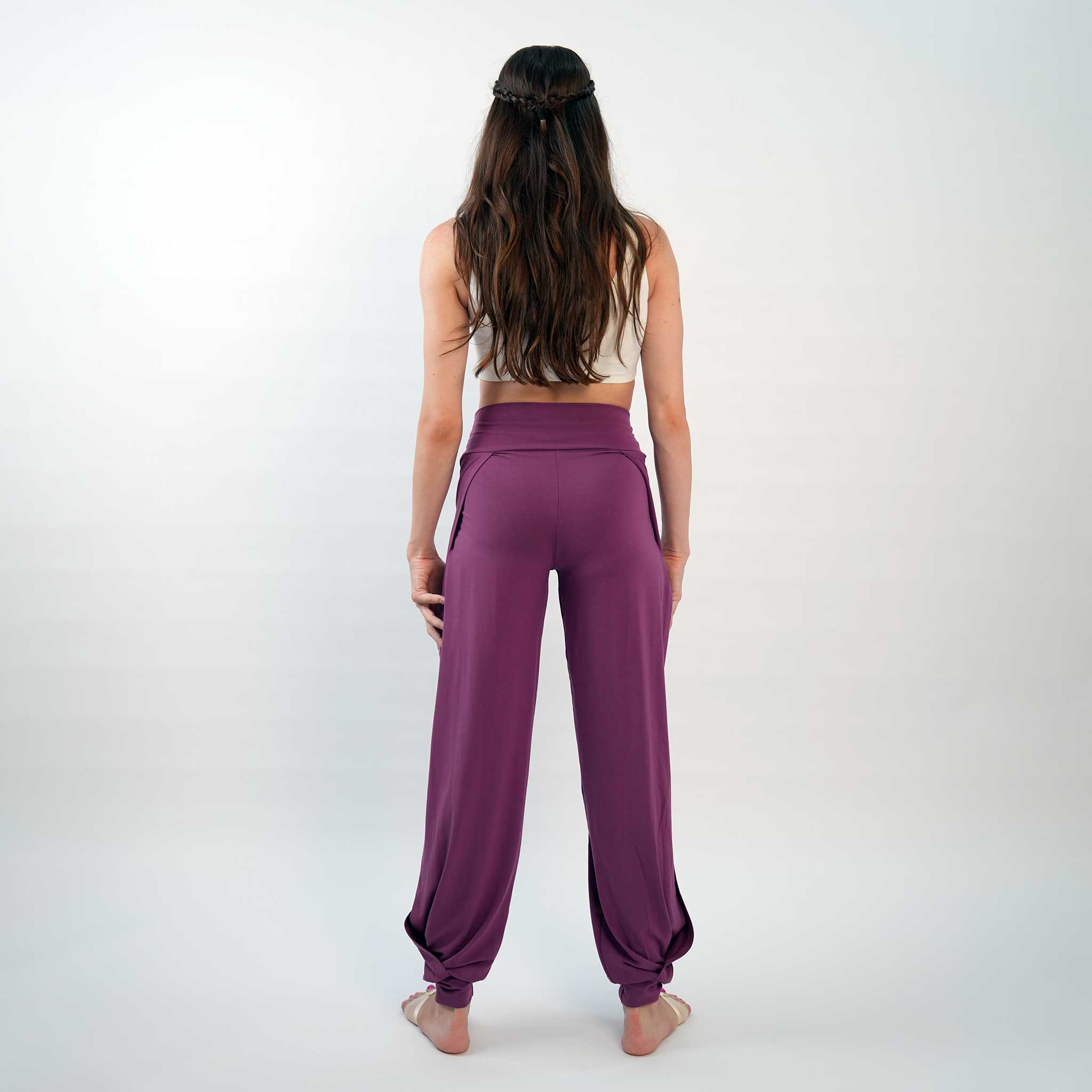 A pair of purple yoga dance jazz pants with a high-waisted fit and wide-leg design, featuring a secure waistband and a gathered ankle hem.