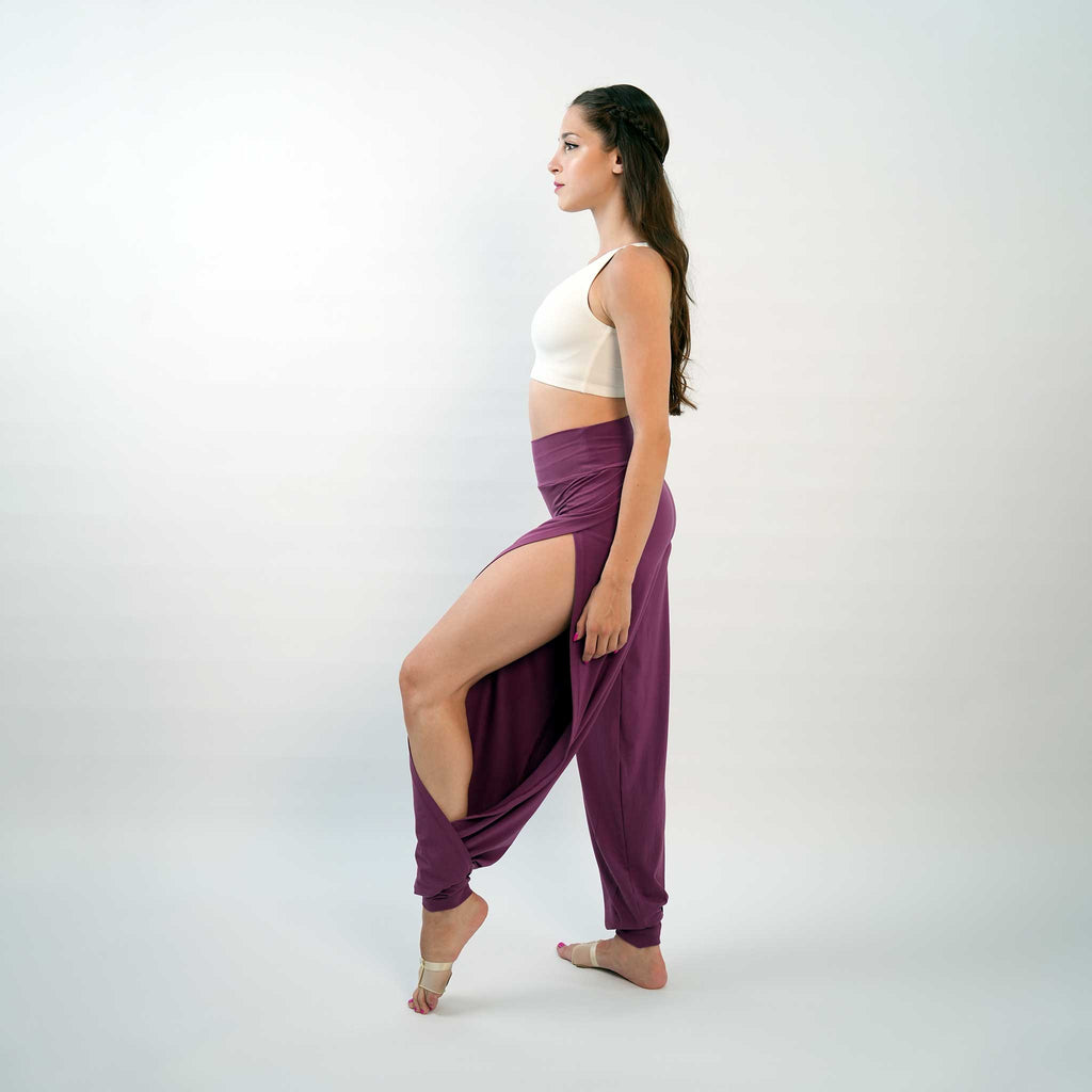 A pair of purple yoga dance jazz pants with a high-waisted fit and wide-leg design, featuring a secure waistband and a gathered ankle hem.