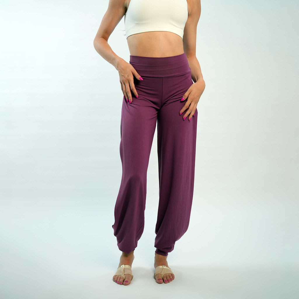 dancer posing in a purple jazz pants