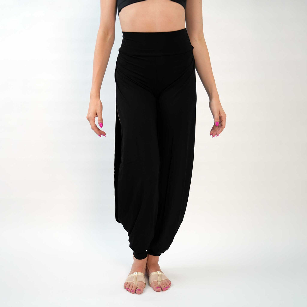 A pair of black yoga dance jazz pants with a high-waisted fit and wide-leg design, featuring a secure waistband and a gathered ankle hem.
