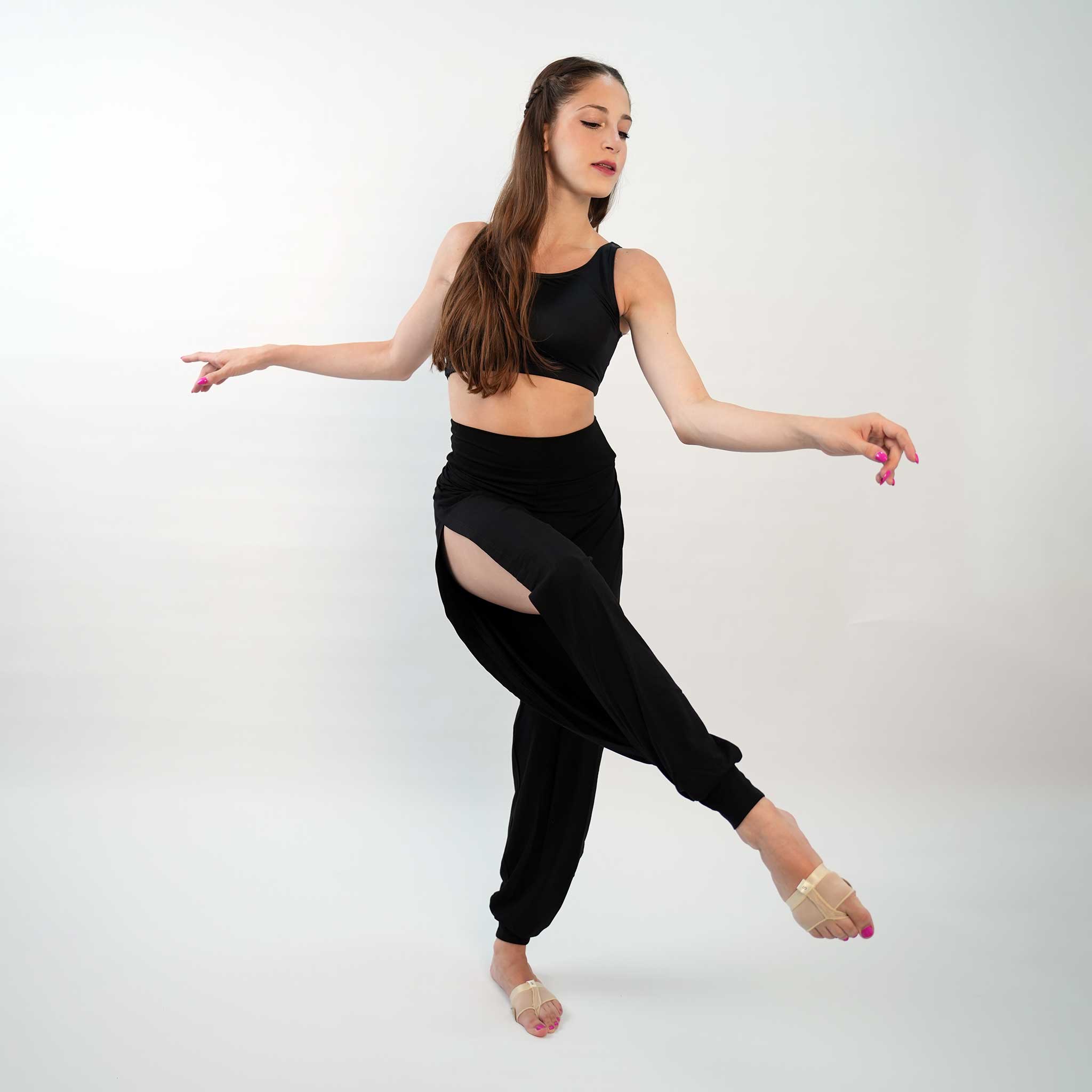 A pair of black yoga dance jazz pants with a high-waisted fit and wide-leg design, featuring a secure waistband and a gathered ankle hem.